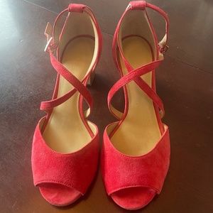 Red ankle-strapped suede sandals